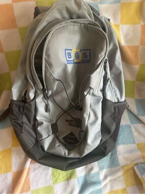 The North Face Light Gray and Dark Gray Men’s Backpack with Bungee Front
